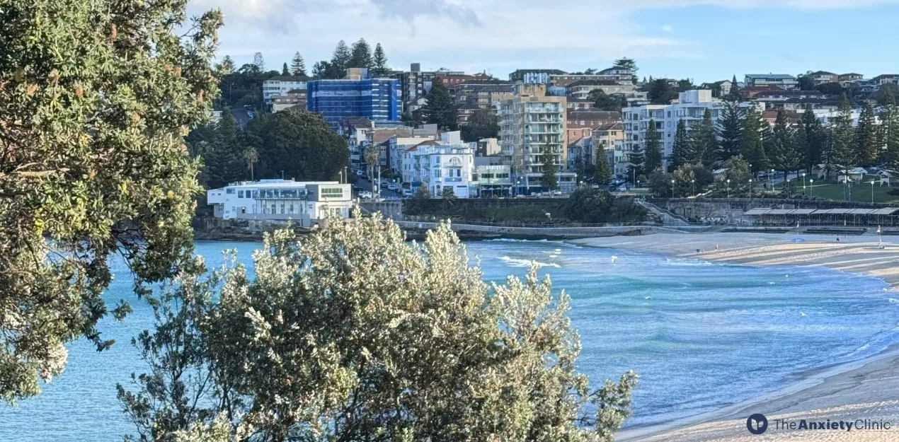 bondi-junction-mental-health-awareness View of Bondi Beach near Bondi Junction, showing calm ocean waves and the coastal community — representing wellbeing and local life in Sydney’s eastern suburbs.