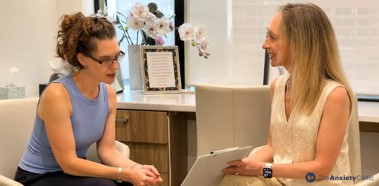Psychologist speaking with a client during a therapy consultation in Sydney.